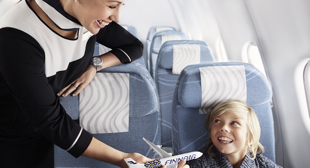 Finnair economy boy and cabin attendant 01 Low (1)
